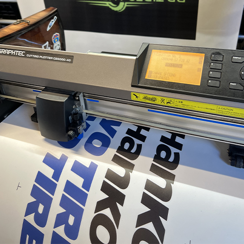 vinyl graphic being printed on large format printer