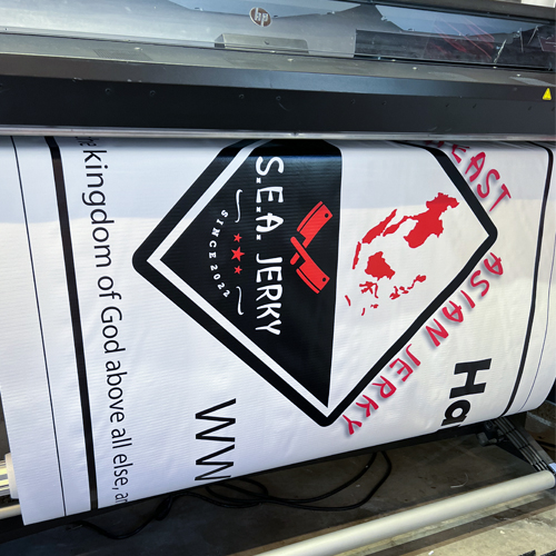 vinyl banner being printed on large format printer